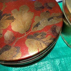 Decorative Red and Gold Tin with Leaf Design
